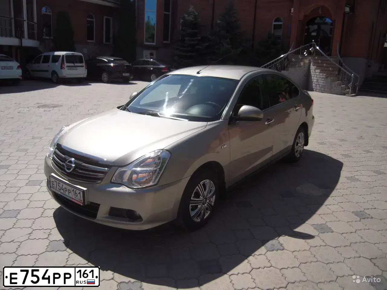 Фото автомобиля NISSAN ALMERA /AVTOVAZ/, 2014 — госномер Е754РР161. Цвет: СЕРО-БЕЖЕВЫЙ