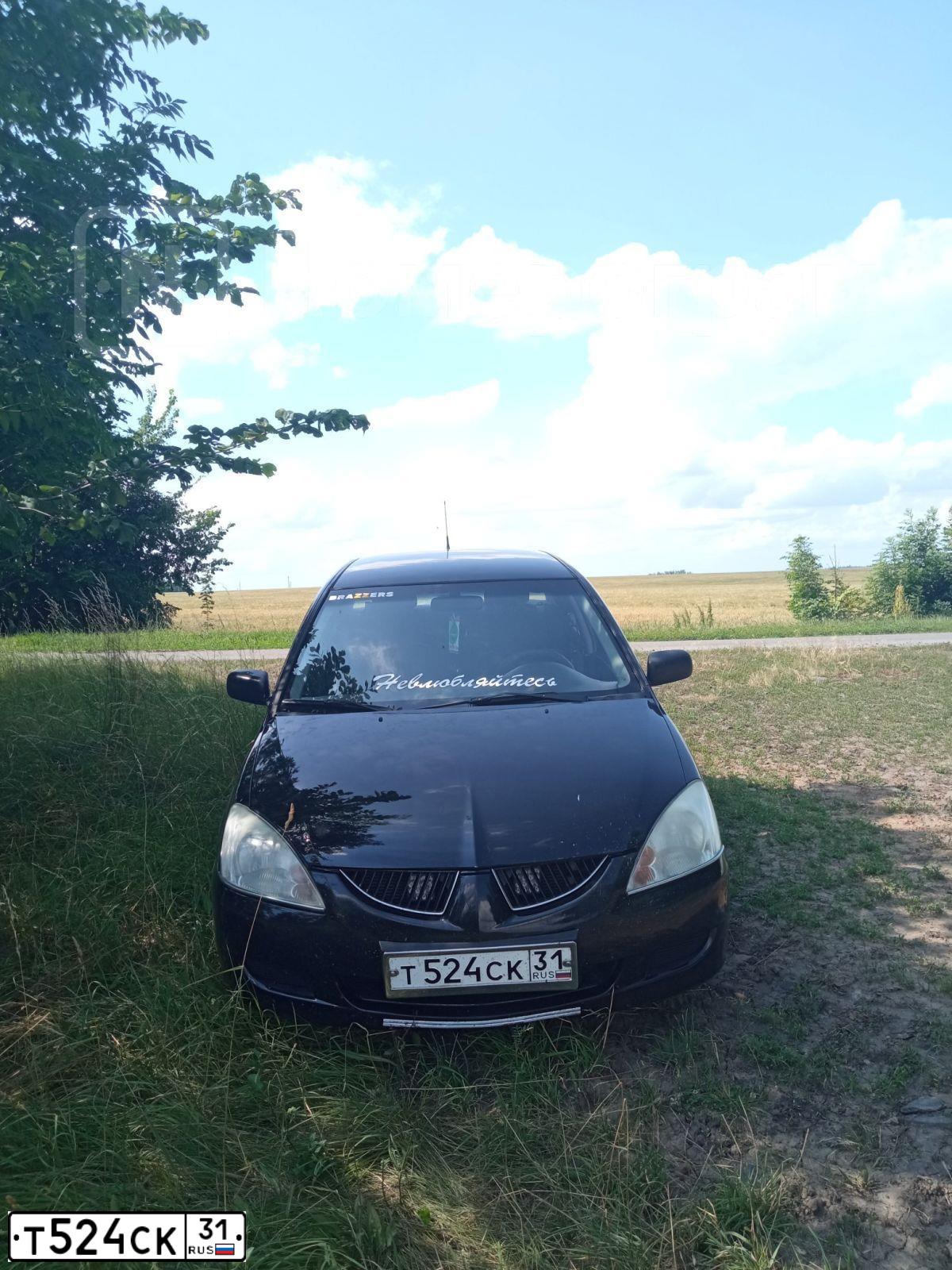 Фото автомобиля MITSUBISHI LANCER, 2005 — госномер М050ОУ31. Цвет: ЧЕРНЫЙ