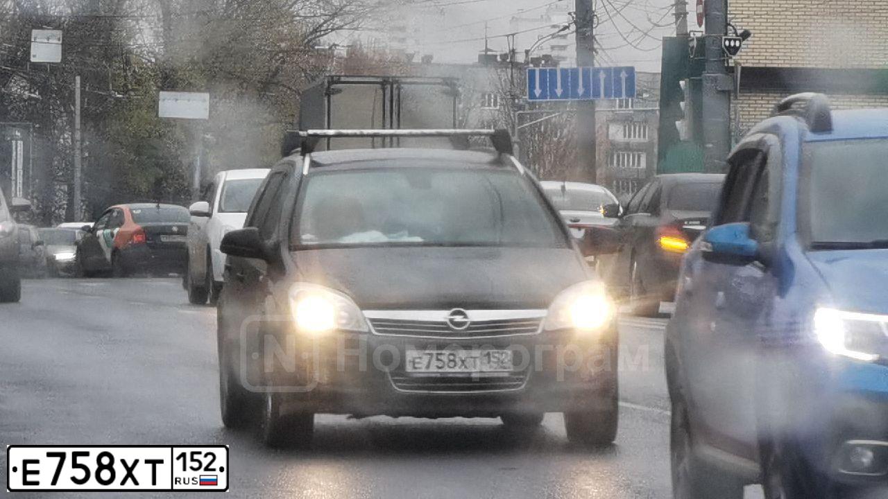 Фото автомобиля OPEL ASTRA, 2011 — госномер Е758ХТ152. Цвет: ЧЕРНЫЙ