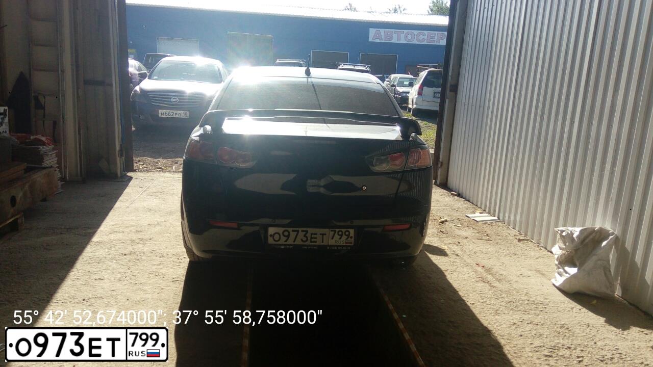 Фото автомобиля MITSUBISHI LANCER, 2010 — госномер О973ЕТ799. Цвет: ЧЕРНЫЙ