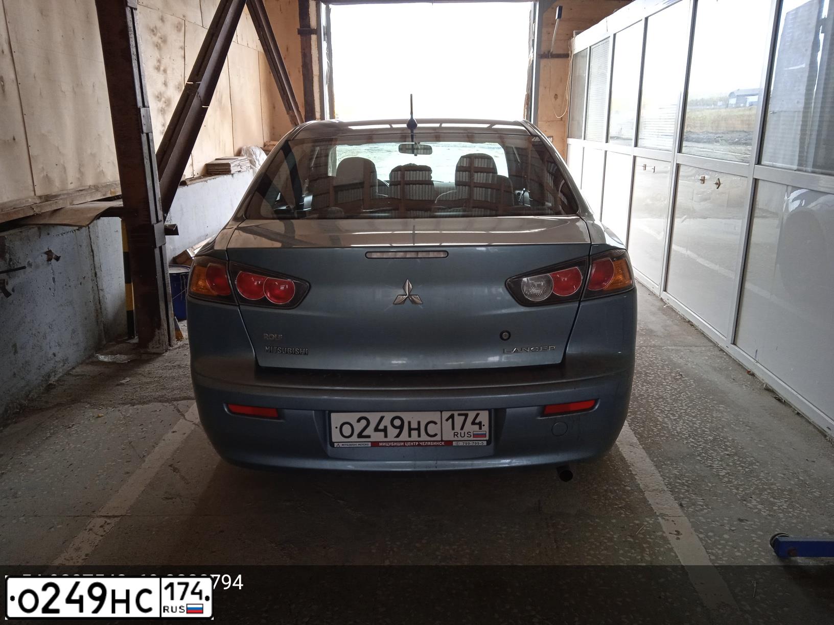 Фото автомобиля MITSUBISHI LANCER, 2011 — госномер О249НС174. Цвет: СЕРЫЙ