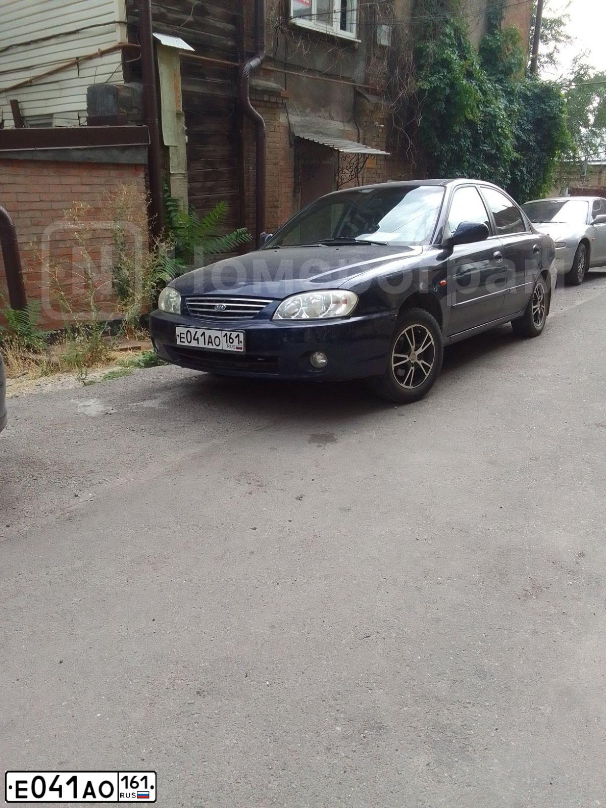 Фото автомобиля KIA SPECTRA, 2008 — госномер Е041АО161. Цвет: Т.СИНИЙ