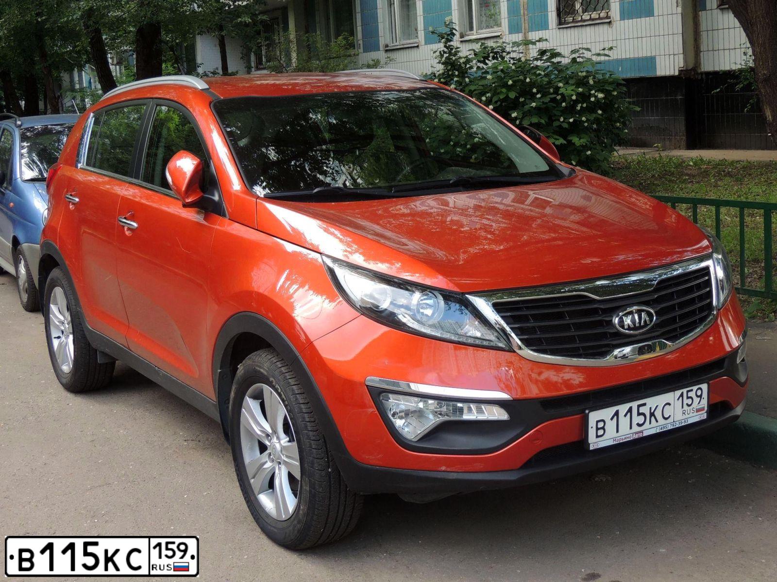 Фото автомобиля KIA SPORTAGE, 2012 — госномер В115КС159. Цвет: ОРАНЖЕВЫЙ