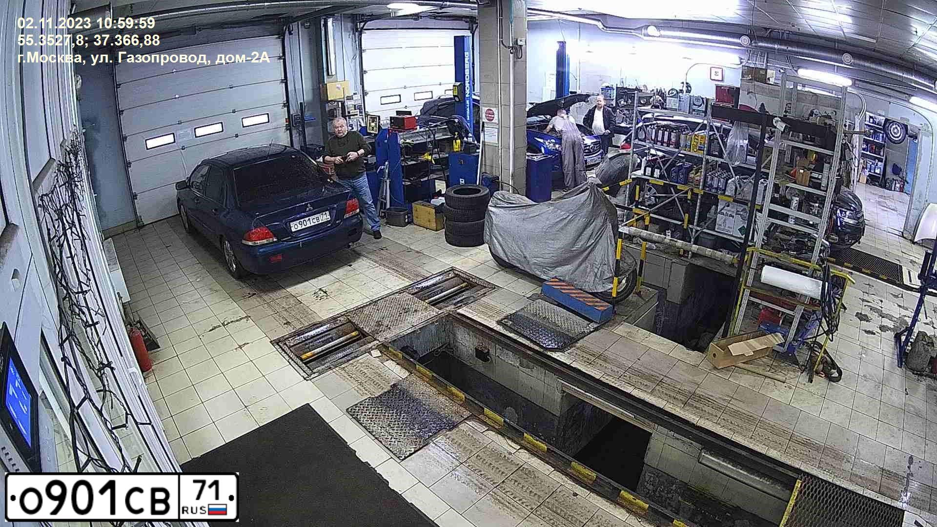 Фото автомобиля MITSUBISHI LANCER, 2006 — госномер Т587АХ977. Цвет: синий