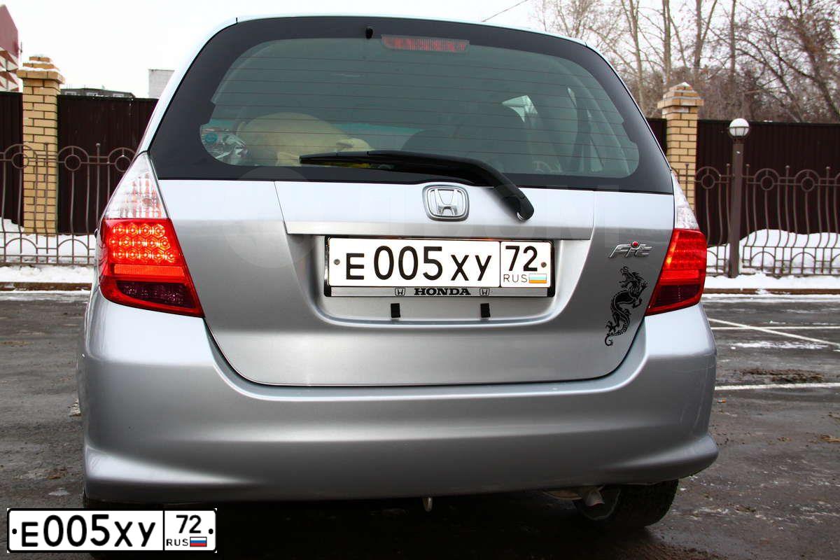 Фото автомобиля OPEL ASTRA, 2013 — госномер Е005ХУ72. Цвет: БЕЛЫЙ