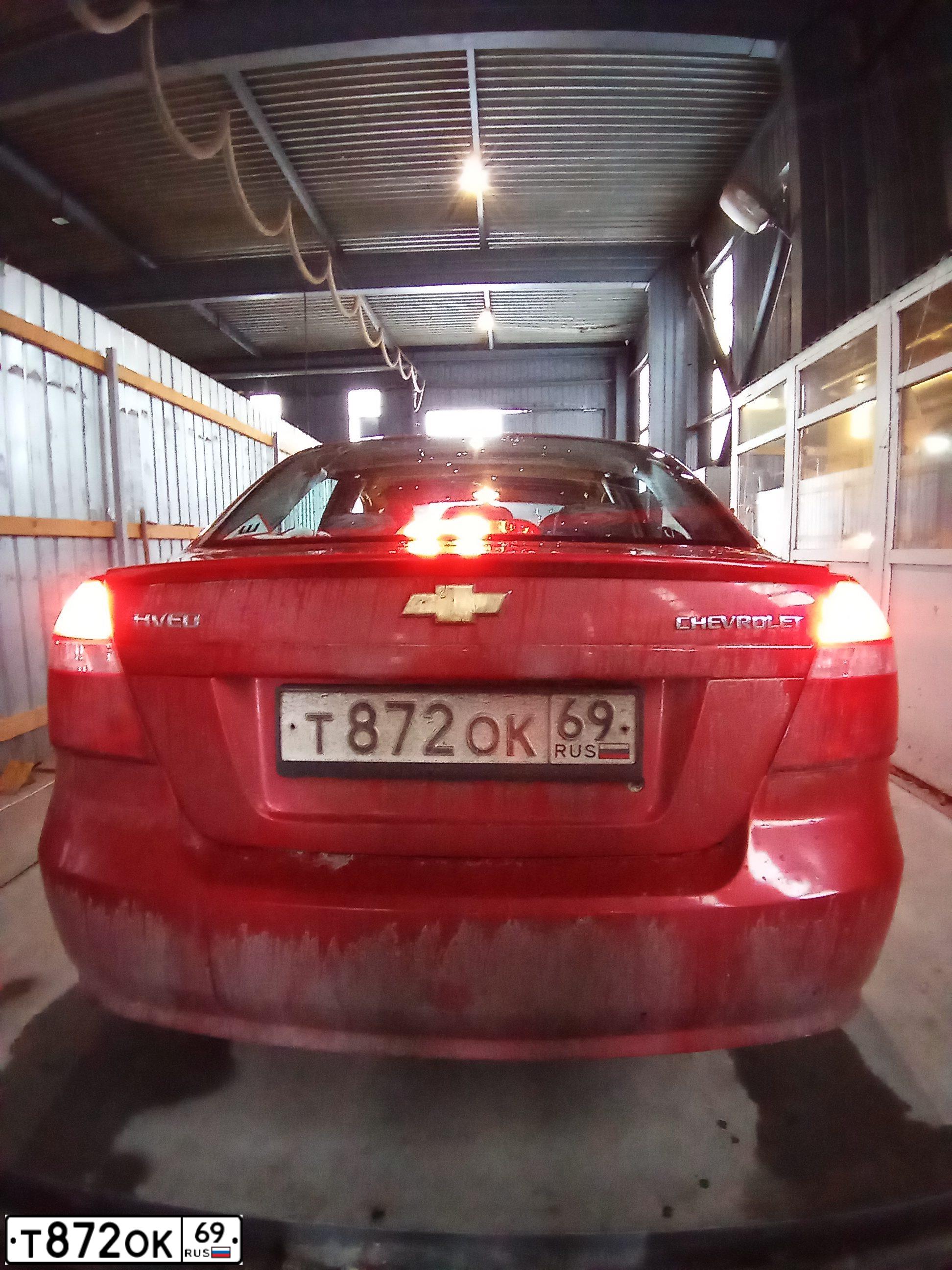 Фото автомобиля CHEVROLET AVEO, 2010 — госномер В779ТЕ69. Цвет: Красный