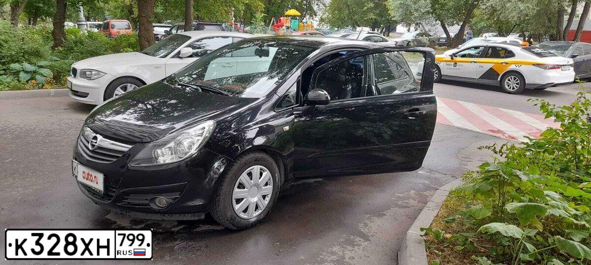 Фото автомобиля OPEL CORSA, 2007 — госномер К328ХН799. Цвет: ЧЕРНЫЙ