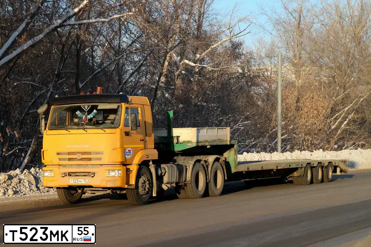 Фото автомобиля KAMAZ 65116 /6X4/, 2014 — госномер Т523МК55. Цвет: ЖЕЛТЫЙ