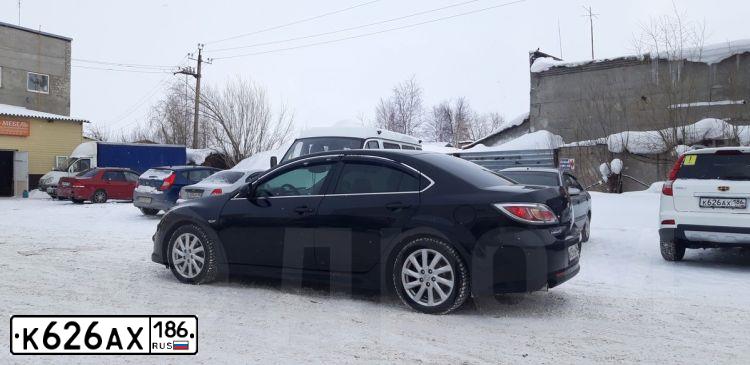 Фото автомобиля GEELY EMGRAND X7, 2016 — госномер К626АХ186. Цвет: Белый