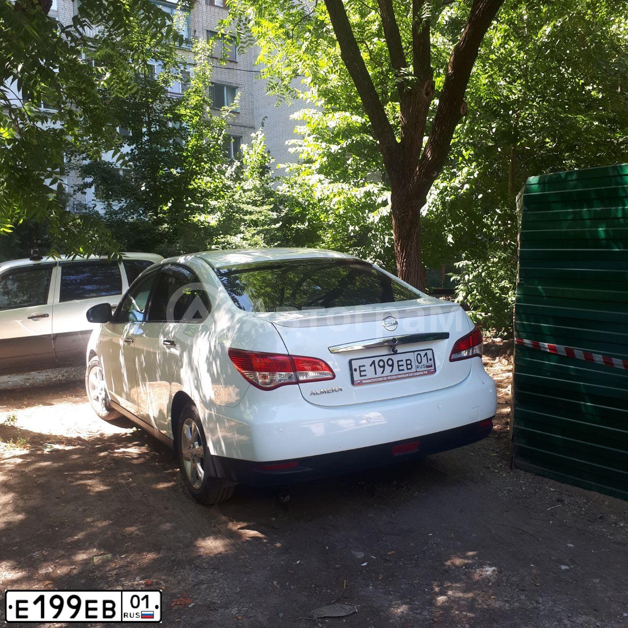 Фото автомобиля NISSAN ALMERA /AVTOVAZ/, 2013 — госномер Е199ЕВ01. Цвет: Белый