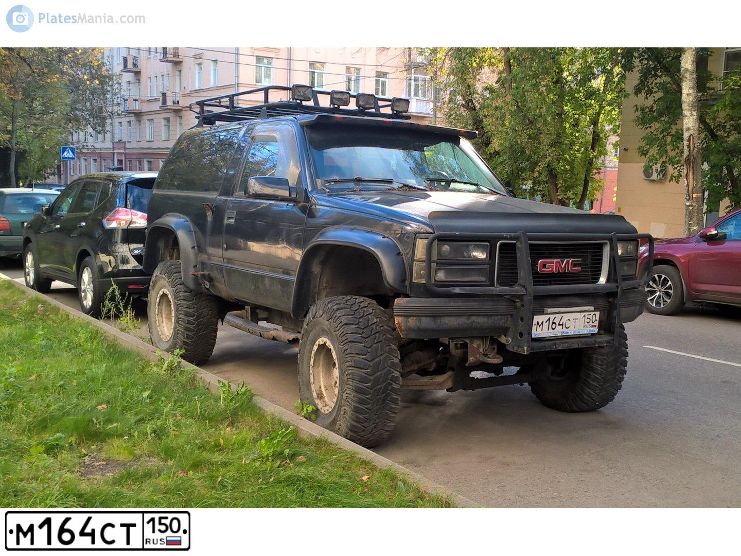 Фото автомобиля GMC YUKON, 1992 — госномер М164СТ150. Цвет: ЧЕРНЫЙ