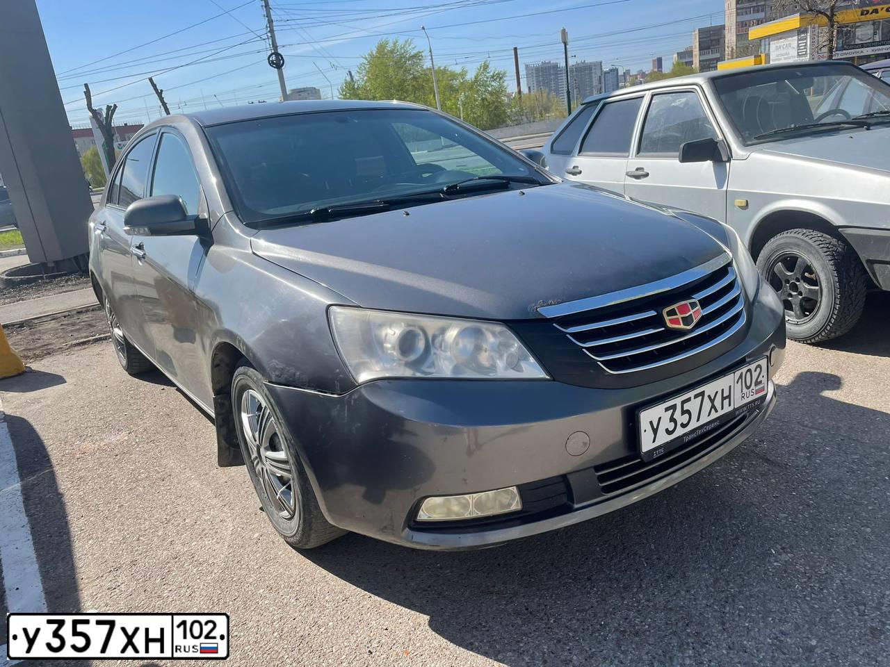 Фото автомобиля GEELY EMGRAND, 2012 — госномер Е887РС702. Цвет: СТАЛЬНОЙ СЕРЫЙ