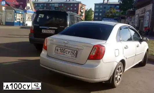 Фото автомобиля CHEVROLET LACETTI, 2007 — госномер У045НУ142. Цвет: Серебристый