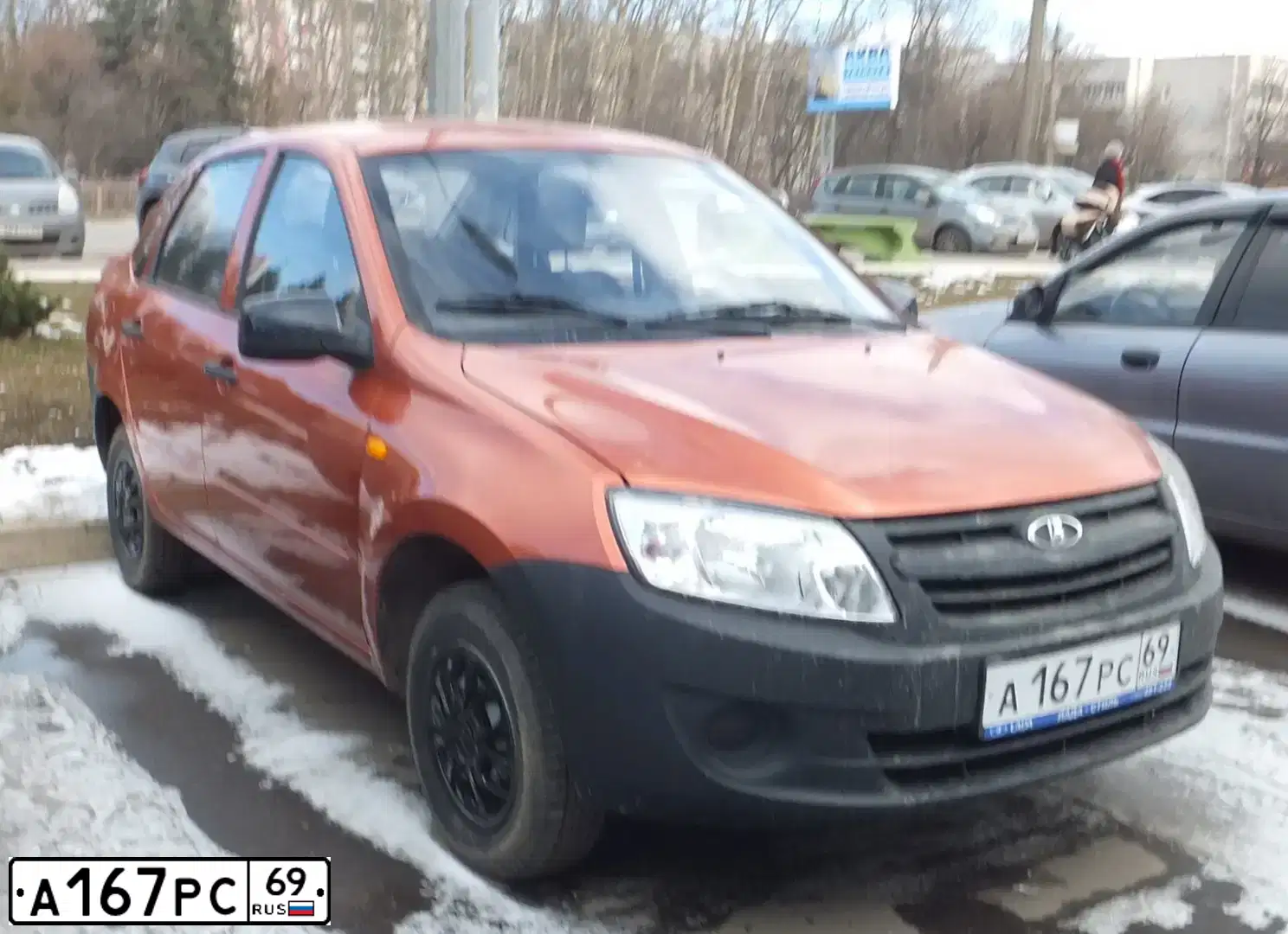 Фото автомобиля LADA 2190 GRANTA, 2014 — госномер А167РС69. Цвет: Оранжевый