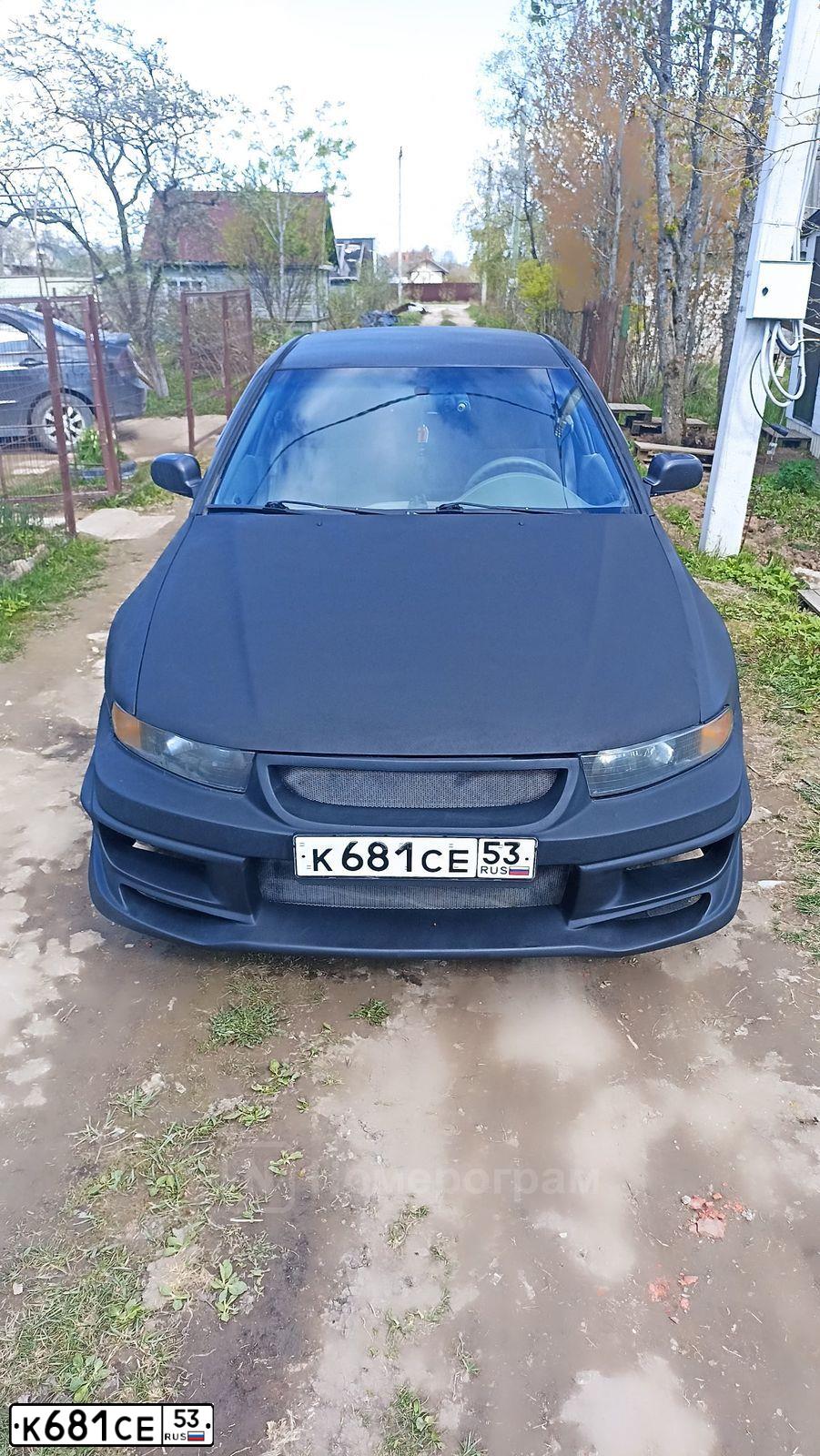 Фото автомобиля MITSUBISHI GALANT, 2002 — госномер О078АА47. Цвет: ЧЕРНЫЙ