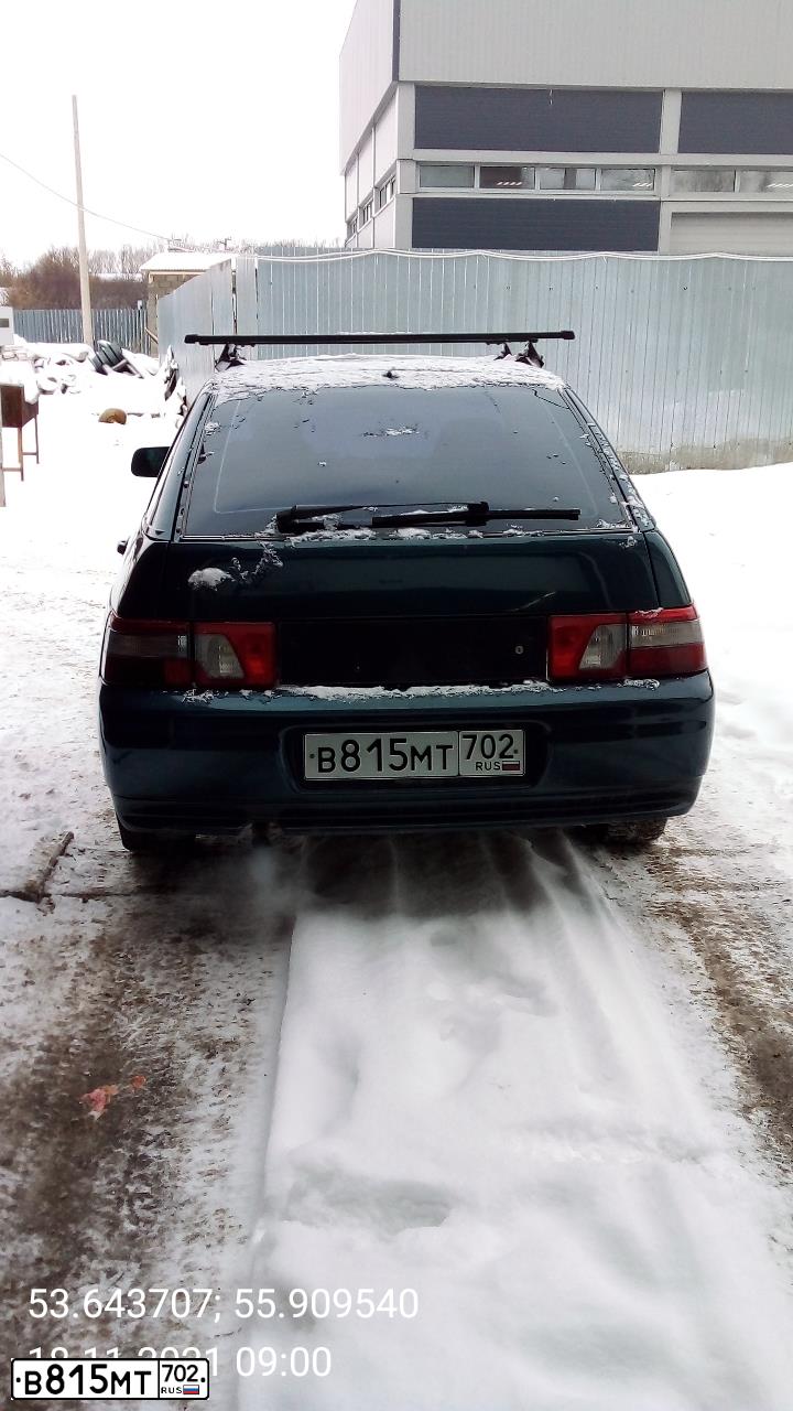 Фото автомобиля LADA 2112, 2007 — госномер В815МТ702. Цвет: Темно-зеленый