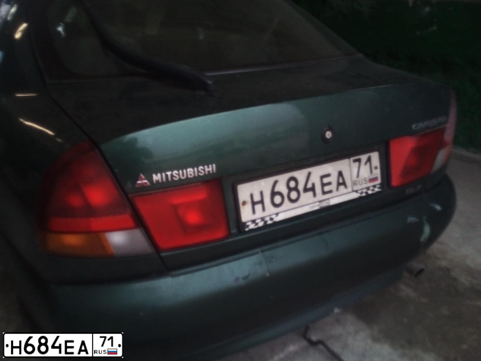 Фото автомобиля MITSUBISHI CARISMA, 1998 — госномер Н684ЕА71. Цвет: ЗЕЛЕНЫЙ
