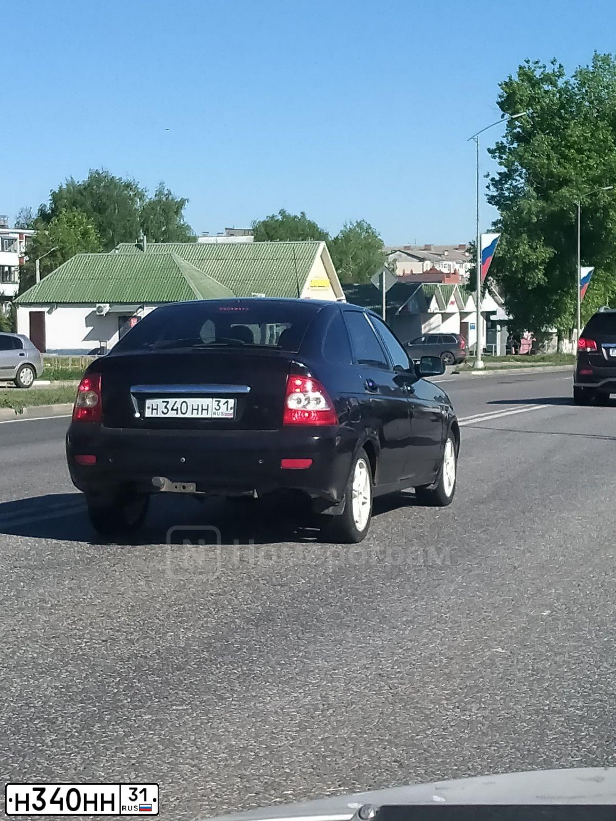 Фото автомобиля LADA 2172 PRIORA, 2009 — госномер Н340НН31. Цвет: СИНЕ-ЧЕРНЫЙ
