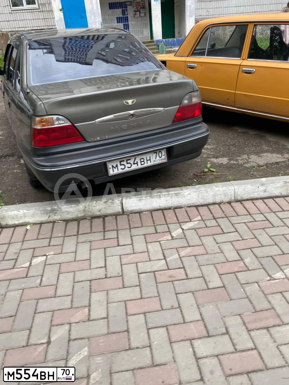 Фото автомобиля DAEWOO NEXIA, 2003 — госномер М554ВН70. Цвет: ТЕМНО-БЕЖЕВЫЙ