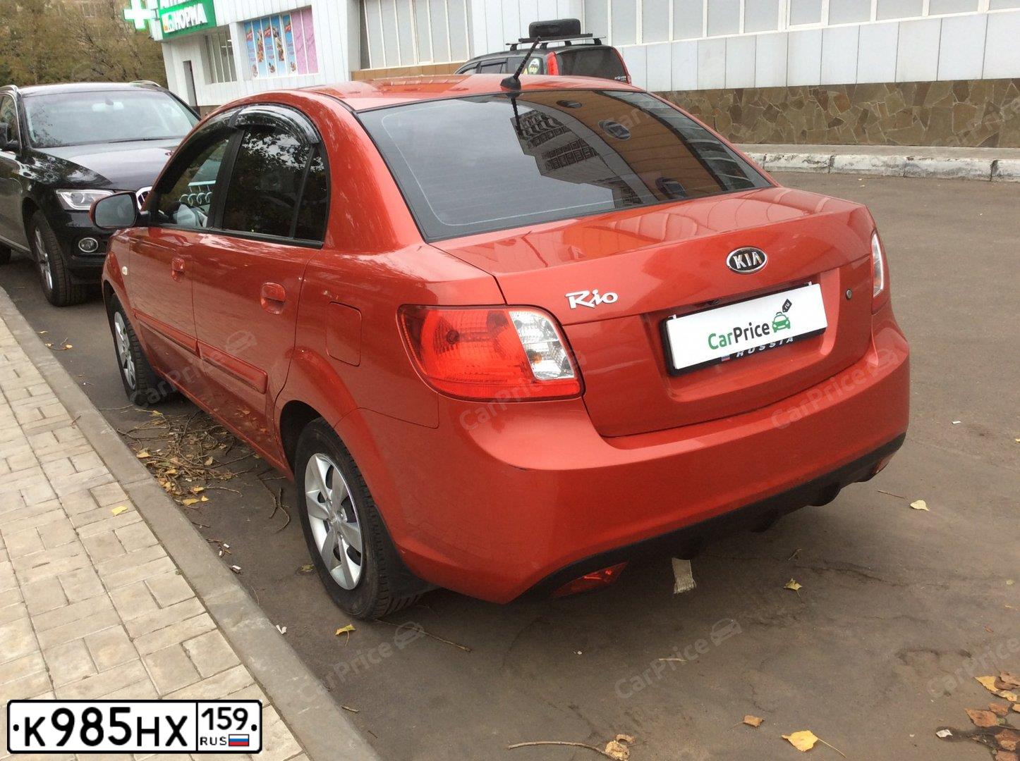 Фото автомобиля KIA RIO, 2009 — госномер К985НХ159. Цвет: Красный