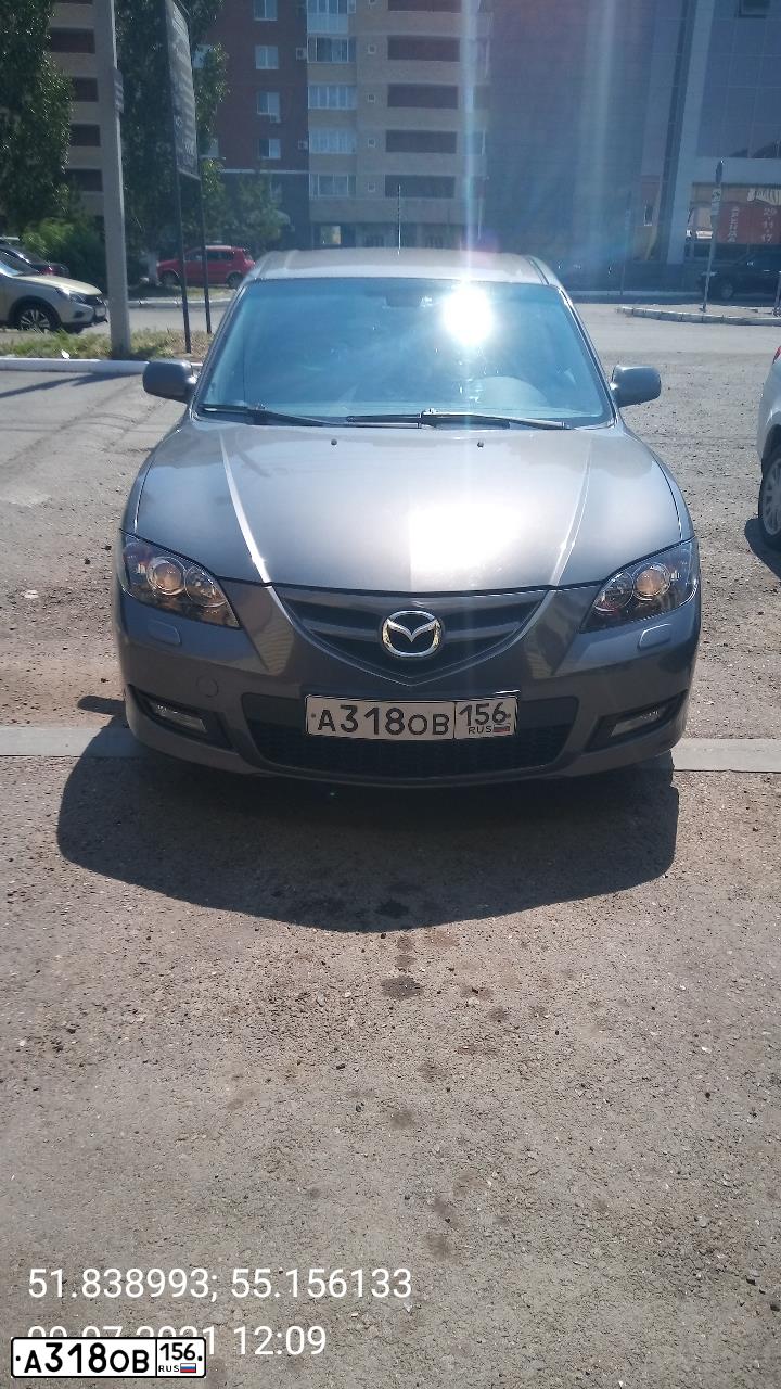 Фото автомобиля MAZDA 3, 2008 — госномер Т056ХС56. Цвет: Серый