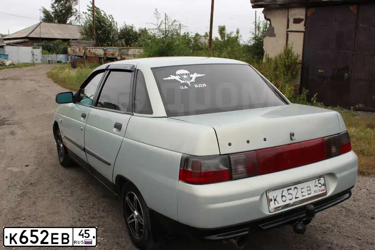 Фото автомобиля LADA 2110, 1999 — госномер Н863КУ45. Цвет: СЕРЕБРИСТЫЙ ЖЕЛТО-ЗЕЛЕНЫЙ
