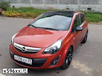 Фото автомобиля OPEL CORSA, 2012 — госномер К596ХХ29. Цвет: ОРАНЖЕВЫЙ