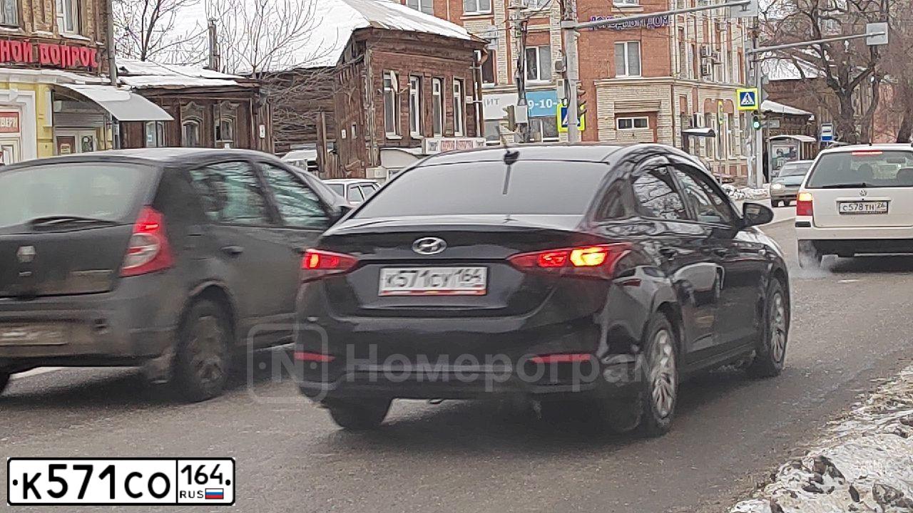 Фото автомобиля LADA 2107, 2008 — госномер К571СО164. Цвет: ВИШНЕВЫЙ