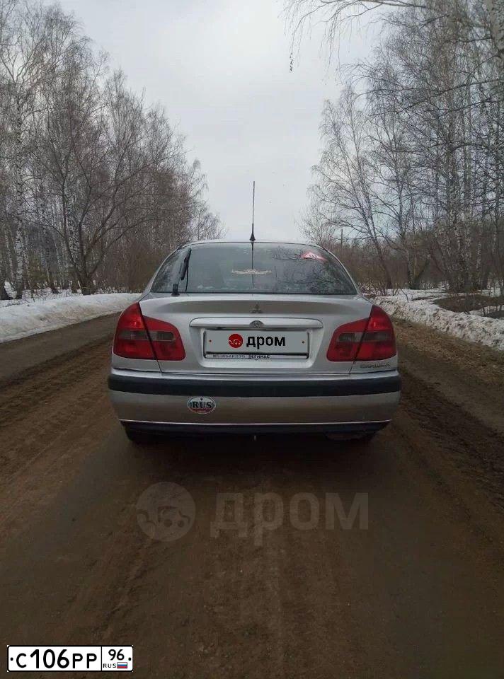 Фото автомобиля MITSUBISHI CARISMA, 2003 — госномер С106РР96. Цвет: СВЕТЛО СЕРЫЙ