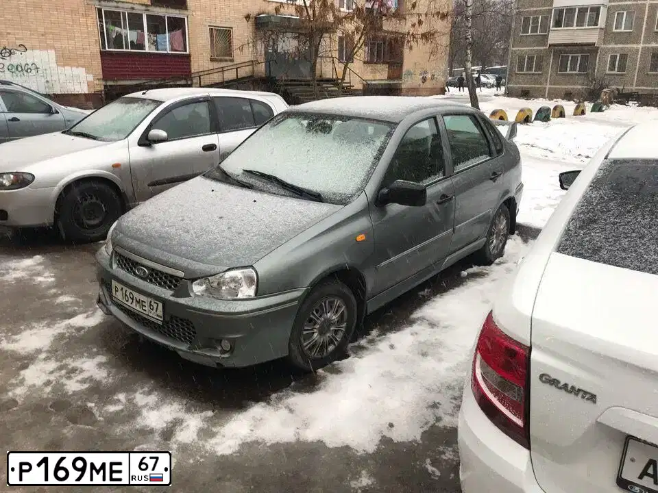 Фото автомобиля LADA 1118 KALINA, 2010 — госномер Р169МЕ67. Цвет: Темно-серый металлик