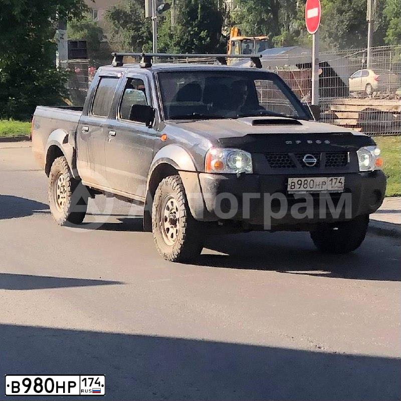 Фото автомобиля NISSAN NAVARA, 2010 — госномер В980НР174. Цвет: ЧЕРНЫЙ
