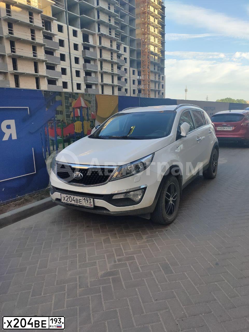 Фото автомобиля KIA SPORTAGE, 2014 — госномер Х515ОМ123. Цвет: Белый