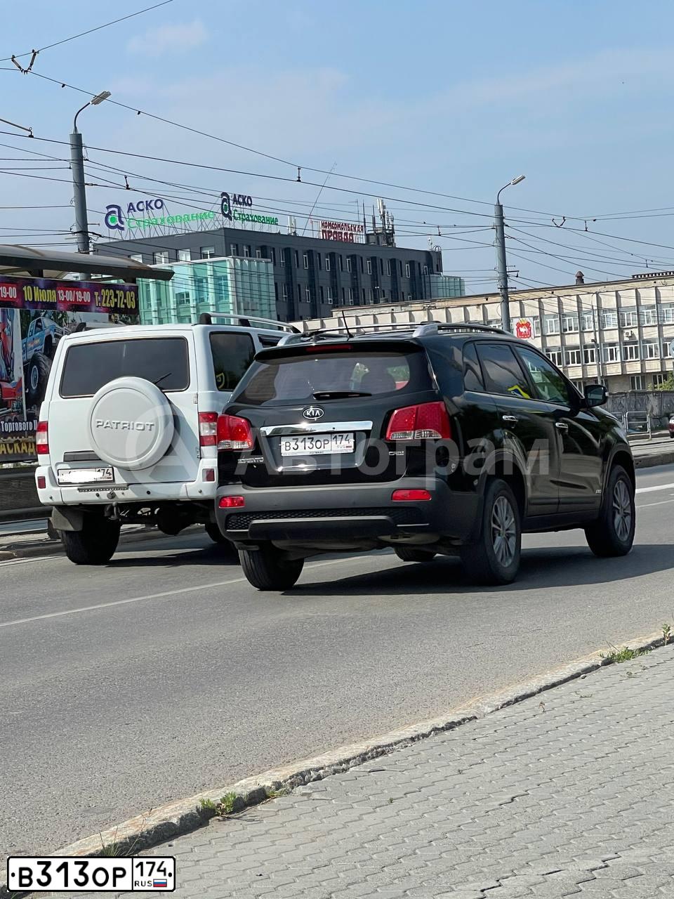 Фото автомобиля KIA SORENTO, 2012 — госномер В313ОР174. Цвет: ЧЕРНЫЙ