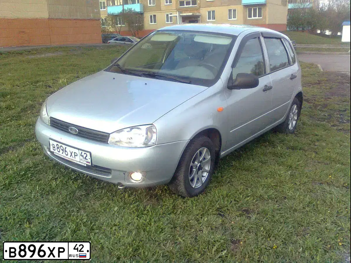 Фото автомобиля LADA 1119 KALINA, 2008 — госномер С595НХ70. Цвет: СЕРЕБРИСТЫЙ