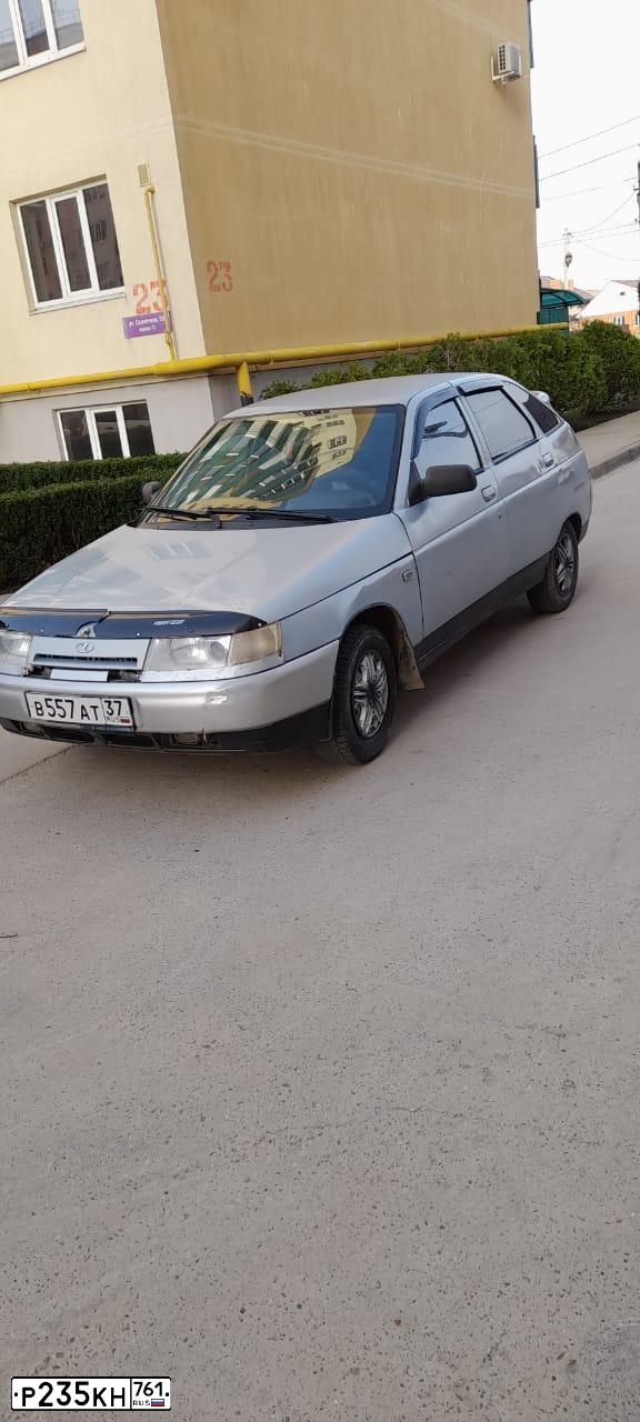 Фото автомобиля LADA 2112 LADA, 2004 — госномер Р235КН761. Цвет: СЕРЕБРИСТО-ЖЕЛТЫЙ