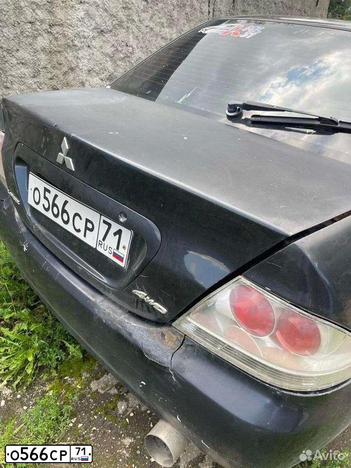 Фото автомобиля МИЦУБИСИ ЛАНСЕР МИЦУБИСИ ЛАНСЕР, 2003 — госномер Х113ОЕ790. Цвет: Черный