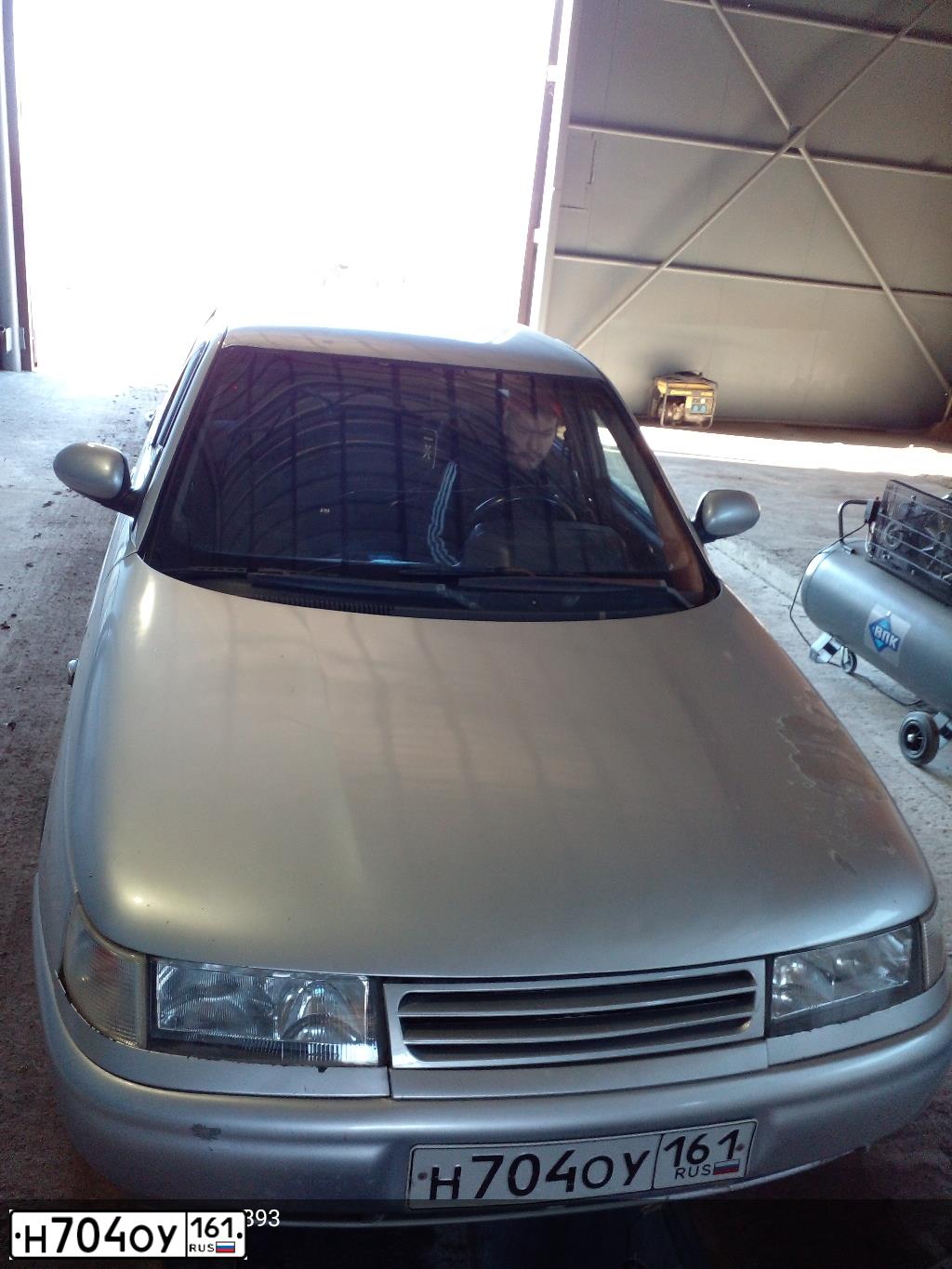 Фото автомобиля LADA 2112, 2004 — госномер Н704ОУ161. Цвет: БЕЛЫЙ СВЕТЛЫЙ