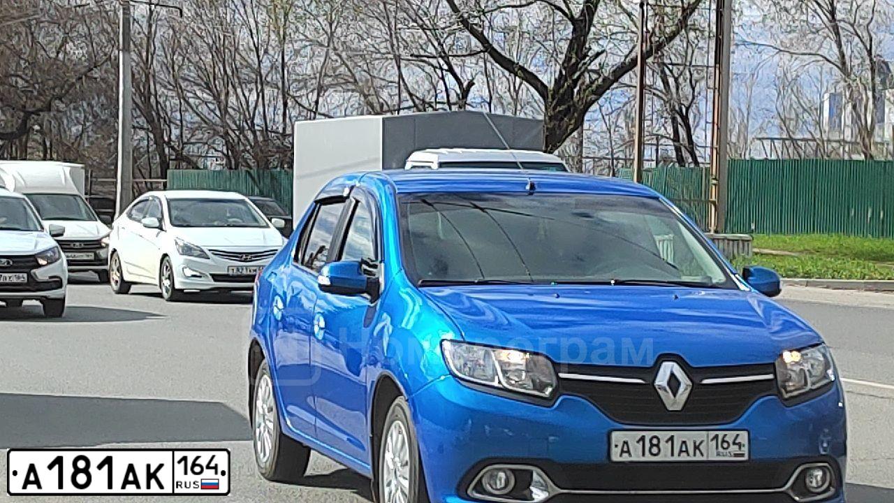 Фото автомобиля RENAULT LOGAN, 2014 — госномер М323ХЕ164. Цвет: СВЕТЛО-СИНИЙ