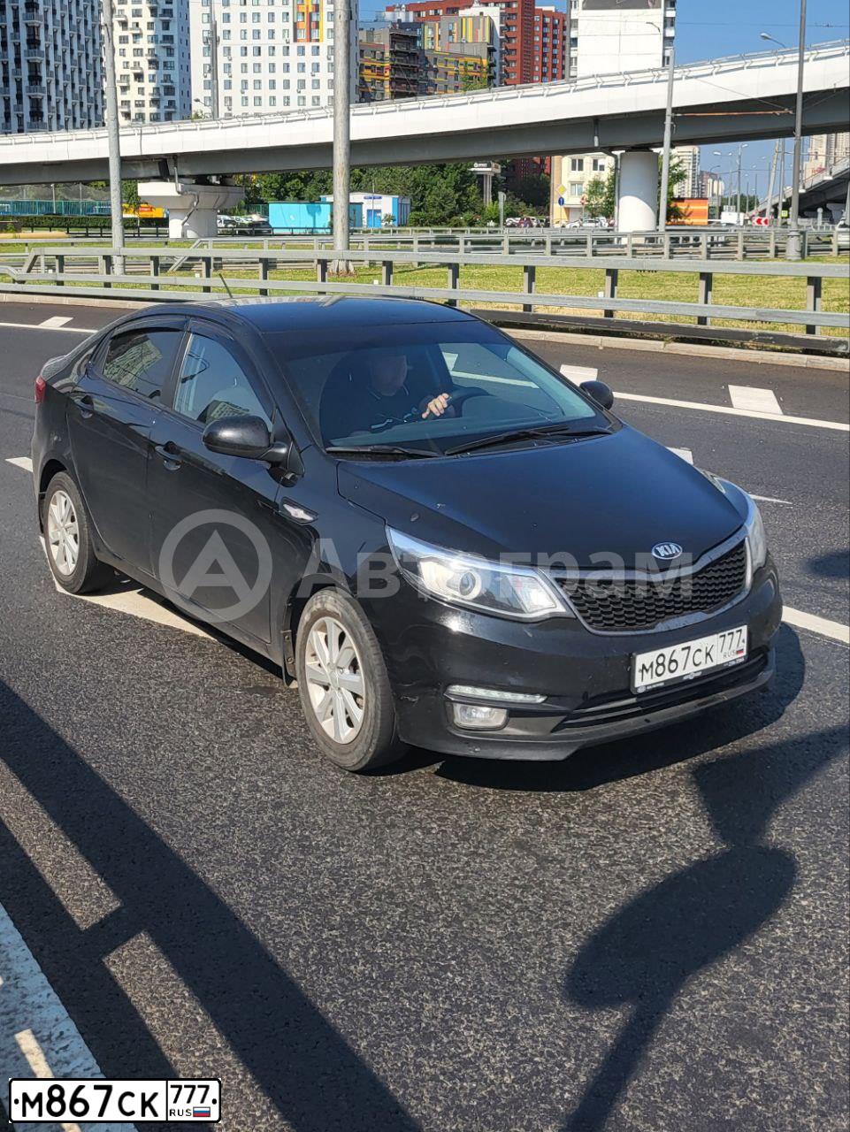 Фото автомобиля KIA RIO, 2016 — госномер М867СК777. Цвет: ЧЕРНЫЙ