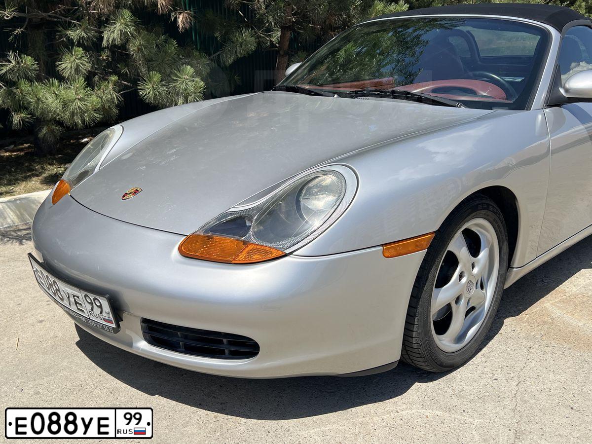Фото автомобиля PORSCHE BOXSTER, 1997 — госномер О034ОО77. Цвет: СЕРЫЙ СВЕТЛЫЙ