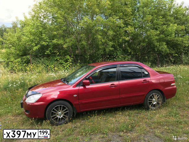 Фото автомобиля MITSUBISHI LANCER, 2005 — госномер Е415УР124. Цвет: Красный