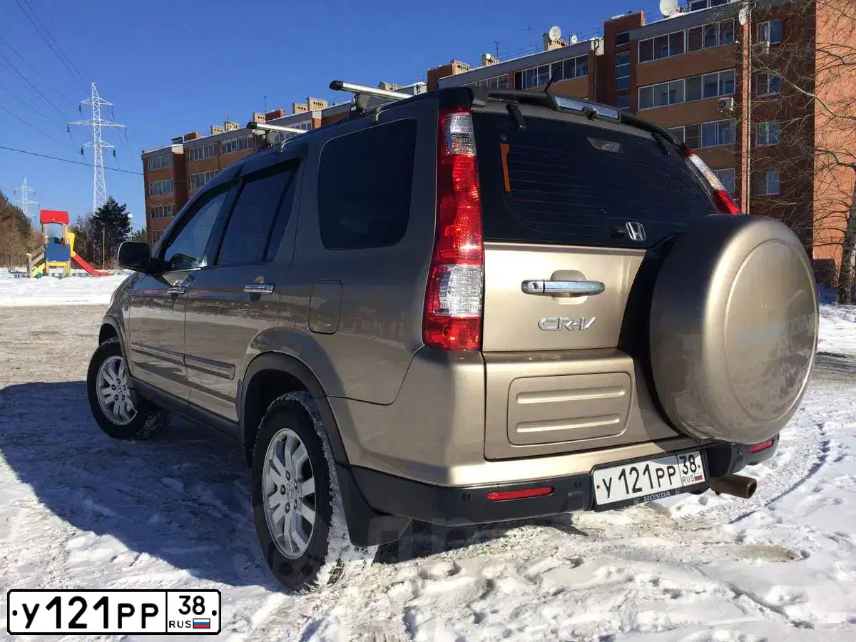 Фото автомобиля HONDA CR-V, 2005 — госномер У121РР38. Цвет: ЗОЛОТИСТЫЙ