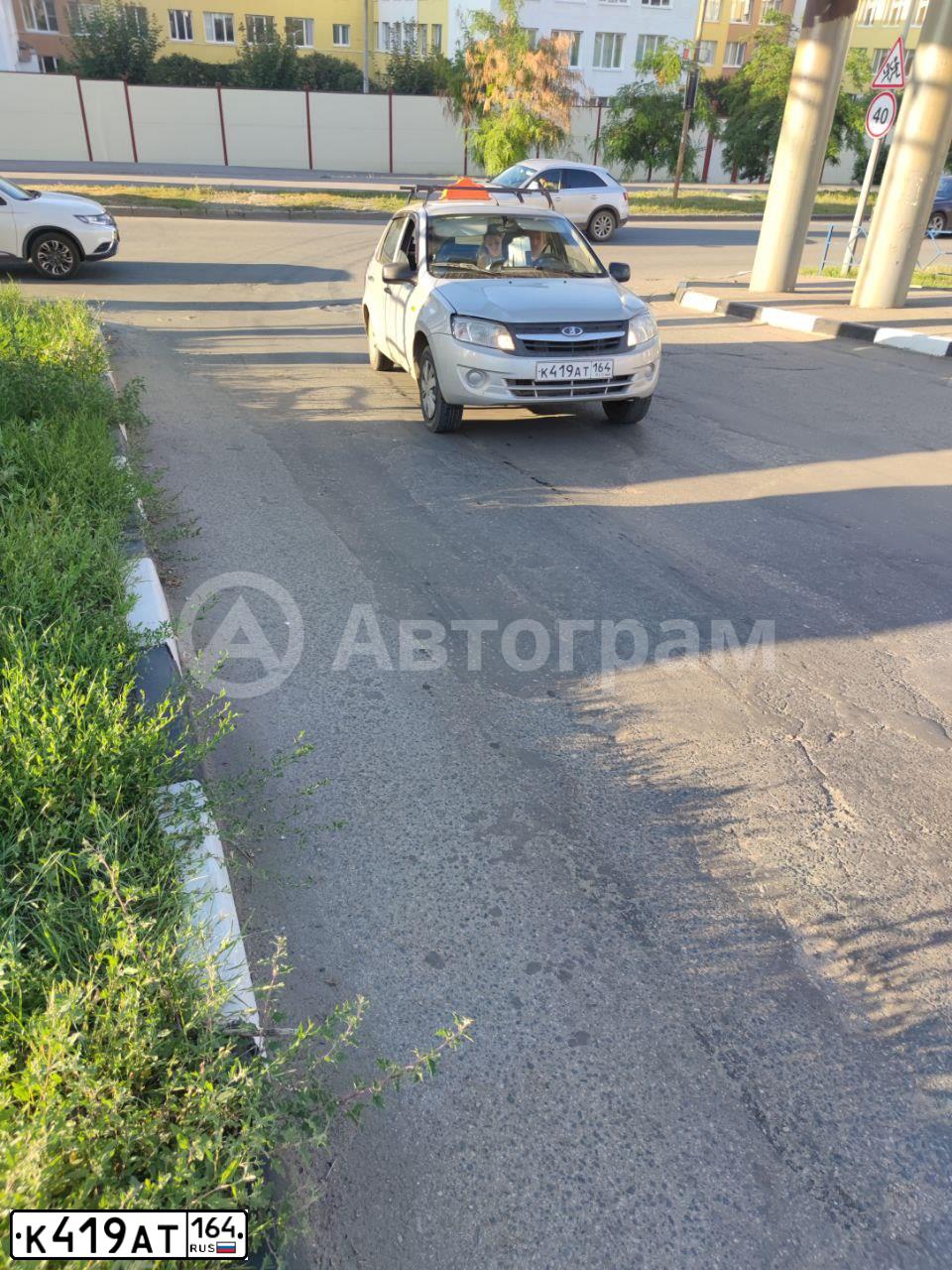 Фото автомобиля LADA 2190 GRANTA, 2013 — госномер К419АТ164. Цвет: Серебристый
