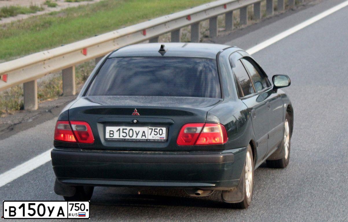 Фото автомобиля MITSUBISHI CARISMA, 2000 — госномер К255СУ71. Цвет: Темно-зеленый