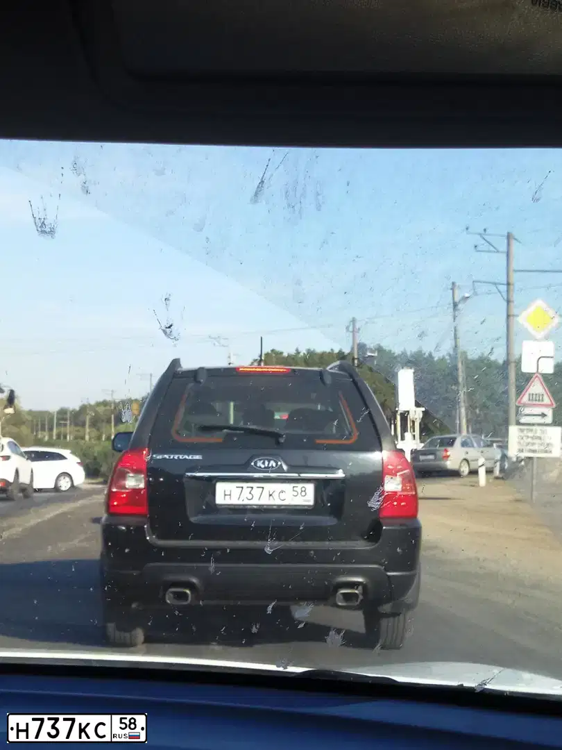Фото автомобиля KIA SPORTAGE, 2010 — госномер Н737КС58. Цвет: ЧЕРНЫЙ ПЕРЛАМУТР