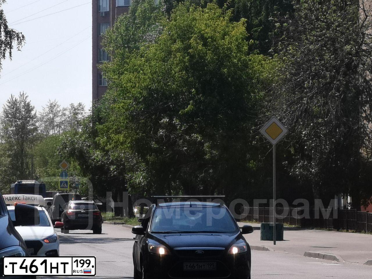 Фото автомобиля FORD FOCUS, 2008 — госномер Т461НТ199. Цвет: ЧЕРНЫЙ