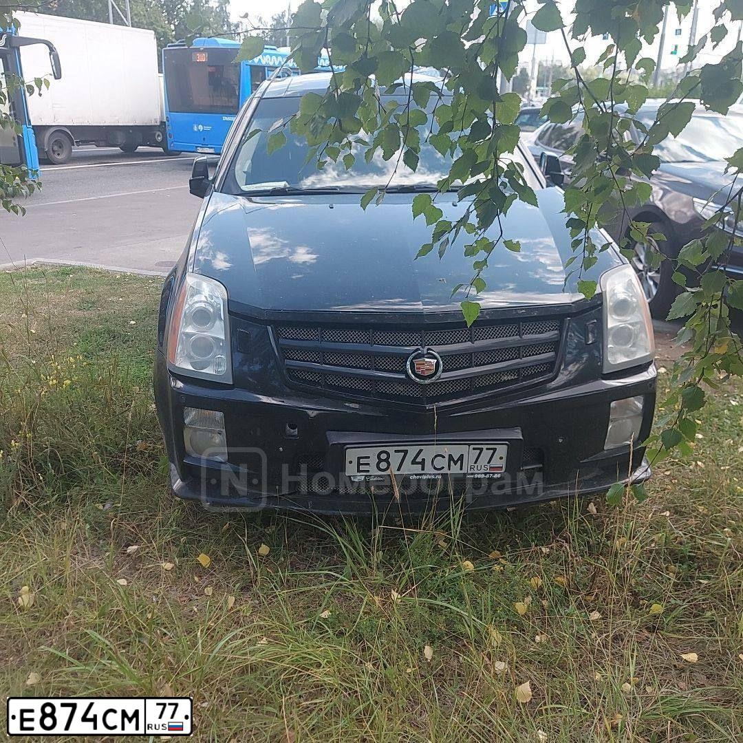 Фото автомобиля CADILLAC SRX, 2007 — госномер Е874СМ77. Цвет: ЧЕРНЫЙ