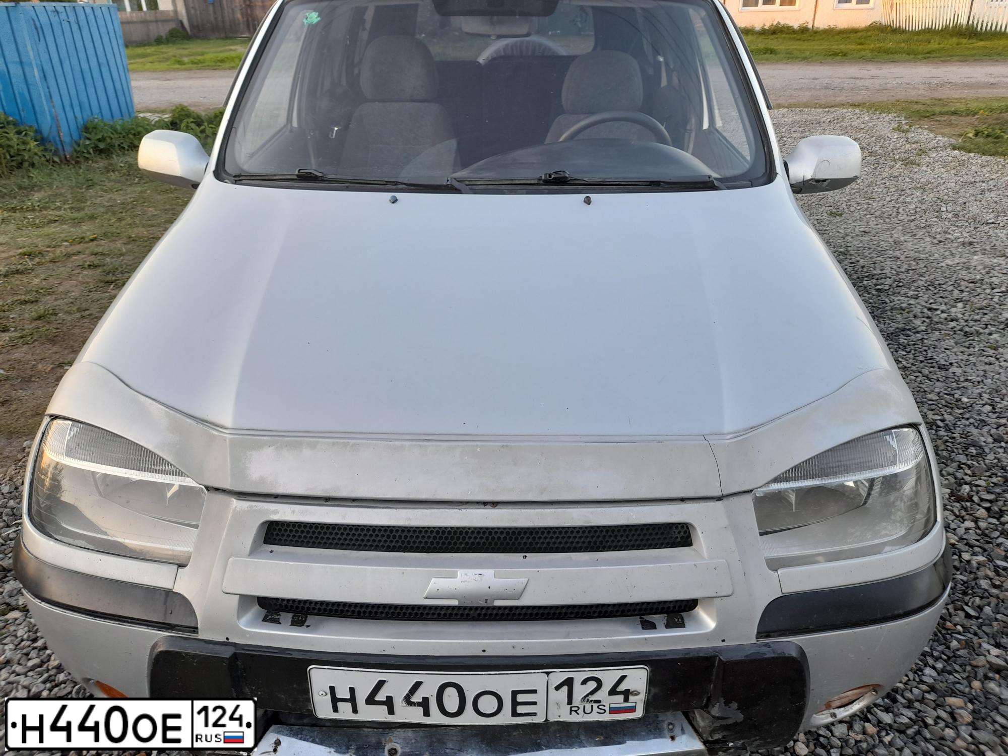Фото автомобиля CHEVROLET NIVA, 2005 — госномер Е718ТУ54. Цвет: СЕРЕБРИСТЫЙ