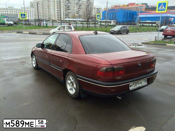 Фото автомобиля OPEL OMEGA, 1994 — госномер В634НС790. Цвет: ВИШНЕВЫЙ