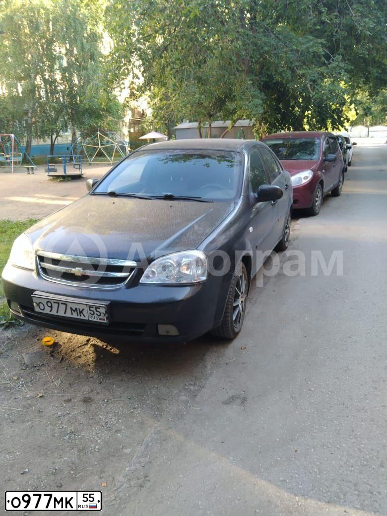 Фото автомобиля CHEVROLET LACETTI, 2008 — госномер О977МК55. Цвет: ЧЕРНЫЙ